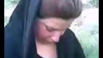 Uninhibited Hijabi Indulging In Outdoor Pleasure